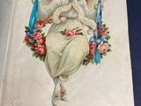 an old book with a picture of an angel on it