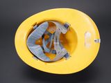 a yellow hard hat with a blue strap on it