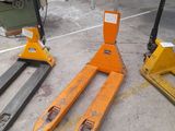 two forklifts sitting on top of each other in a warehouse