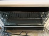 a toaster oven with a toaster on the inside of it