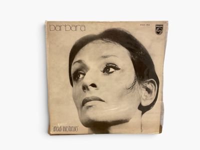 a close up of a magazine with a woman ' s face on it