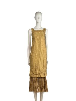 an image of a mannequin wearing a yellow dress with fringes