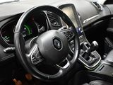 the interior of a car with a steering wheel and dashboard controls