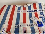 a piece of luggage that has been wrapped up and is sitting on a table