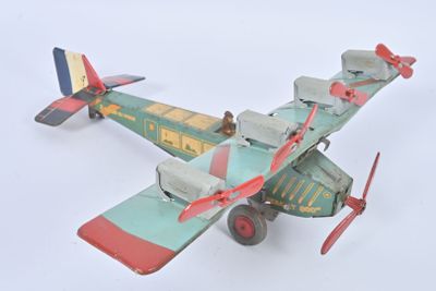 a toy airplane that is flying in the sky
