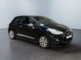 the black citrole is parked in a large room
