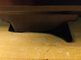a close up of a television on a wooden table