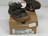 baby girl ' s black and white polka dotty shoes in a box