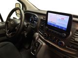 the interior of a car with a steering wheel, dashboard, and dashboard controls