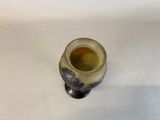 a small vase that is sitting on a table