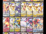 a lot of pokemon cards that are on the table