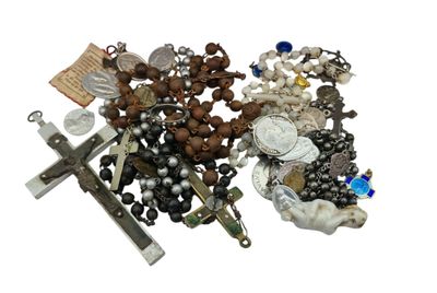 a lot of beads and a cross on a white background