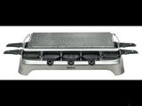 a close up of a grill on a white background with a black background