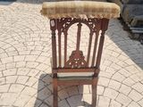 a small chair that is sitting on a brick patio