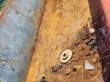 a dump truck that has a lot of trash in it