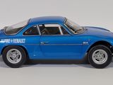 a blue toy car that is sitting on a white surface