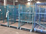 many cages that are in a warehouse with a lot of them