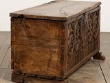 an old wooden chest sitting on a wooden floor