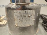 a metal container with a label on it sitting on a table