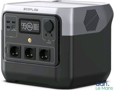a black and silver electronic device with a clock on it