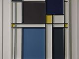abstract painting of blue, yellow, and black squares in a white frame