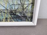 painting of a river with trees and grass in a white frame