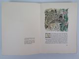 an open book with a drawing of a man and a woman sitting on a bench