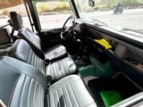 a view of the inside of a car from the driver ' s seat
