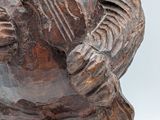 a statue of a man holding a guitar in his hands