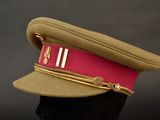 a military hat with a red band on it