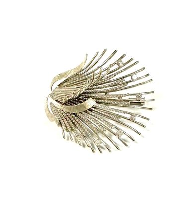 silver plated brooch with feathers on it on a white background