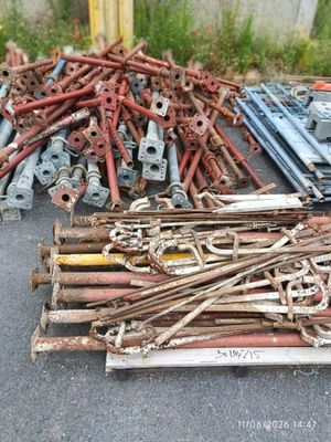 a pile of old rusty metal items on the ground