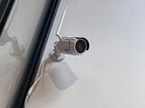 a picture of a security camera attached to a wall