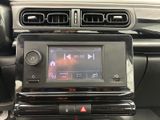 a radio in the center of a car that is connected to the radio