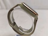 an apple watch sitting on top of a clear stand on a white surface