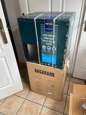 boxes are stacked on top of each other in a room