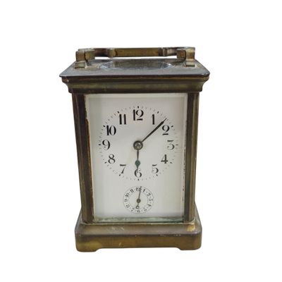 a small clock that is sitting on a table
