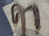 a brown leather belt on a mannequin display
