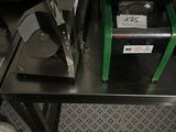 a machine that is sitting on top of a metal table
