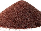 a close up of a pile of dirt on a white background