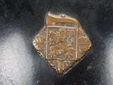 a close up of a metal object with a clock on top of it