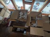 many boxes that are sitting on the floor next to a window