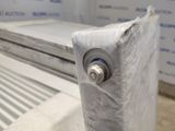 a close up of a piece of plastic covering a metal radiator