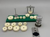 a green table with a bunch of buttons and a machine