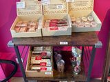 many boxes of food sitting on a table in a store
