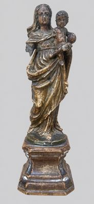 statue of a woman holding a child on a pedestal