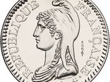 gros plan d'une pièce de monnaie sur laquelle figure une tête de femme