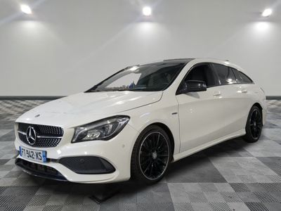 a white mercedes cla parked on a checkered floor