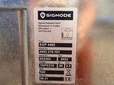 a sign on the side of a refrigerator that says signode