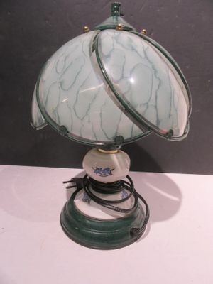 a lamp that is sitting on a table in a room